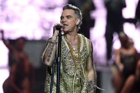 robbie williams boob flashers|Robbie Williams' cheeky quip as he's flashed by excited fan at .